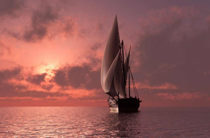 Sailboat sailing on the sea at sunset