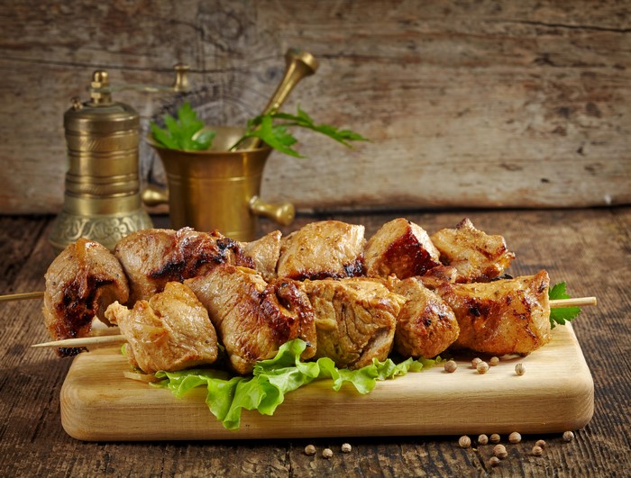 Shashlik on a cutting board with spices