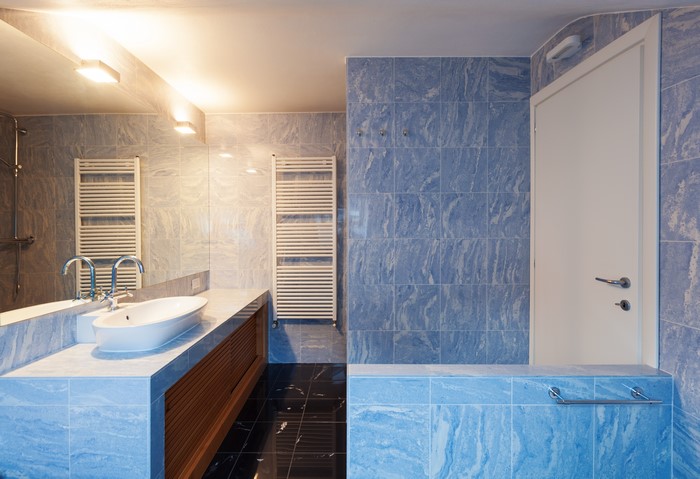 Modern Bathroom with Blue Tiles and Mirror