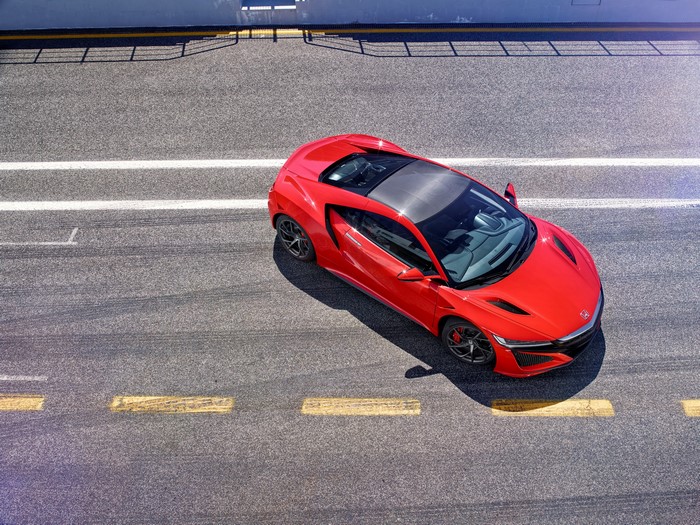 Red 2016 Honda NSX from above on asphalt