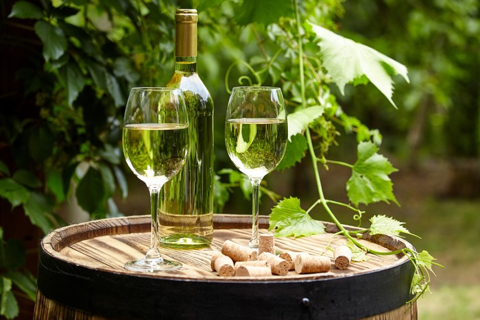 White Wine Bottle and Glasses on Barrel