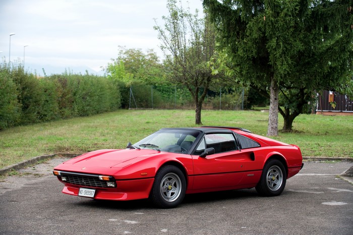 Red Ferrari 308 GTS Quattrovalvole parked outdoors