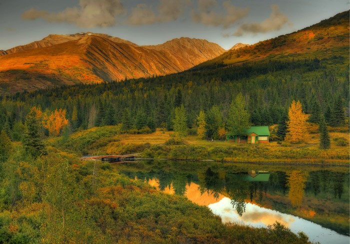 Cabin by a lake in Alaska during autumn