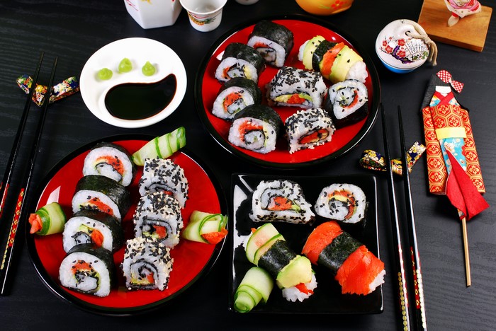 Sushi platter with chopsticks and Japanese decorations