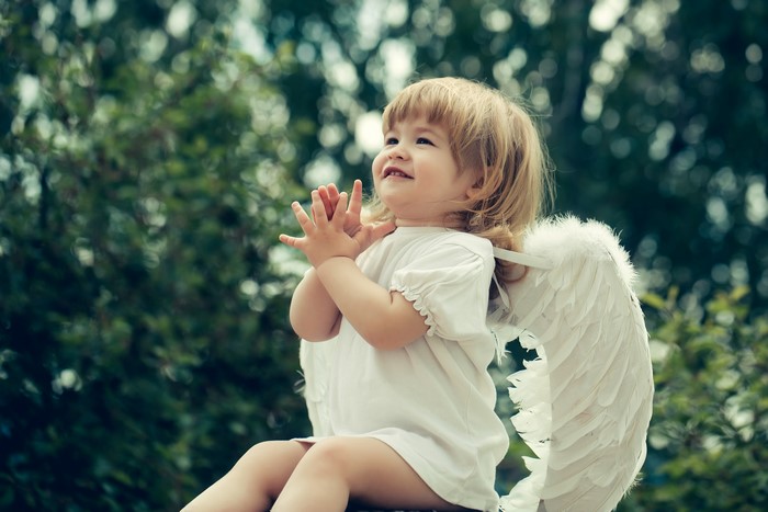 Little girl with angel wings