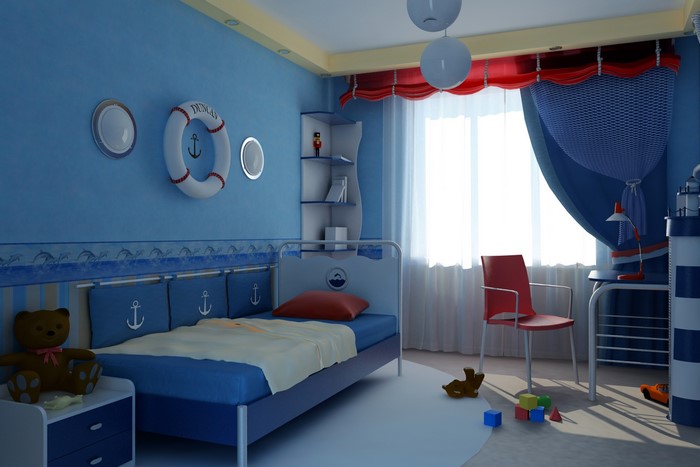 Nautical themed bedroom with a bed, chair, and toys
