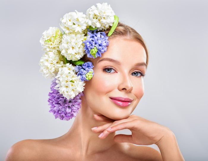 Blonde girl with hyacinths in her hair