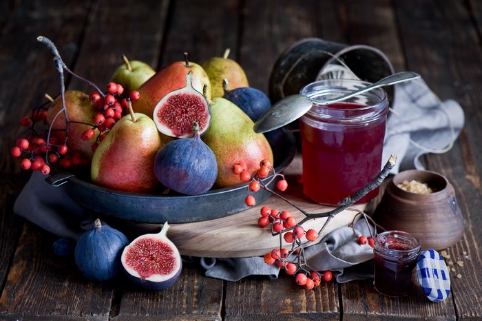 Still-life of pears, figs, berries, and jam