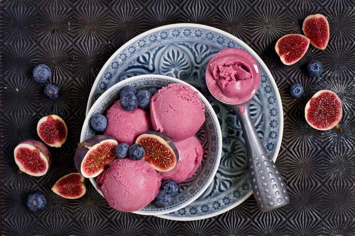 Ice cream with blueberries and figs on a plate