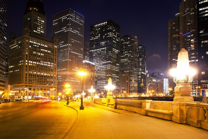 Chicago city street at night with illuminated buildings
