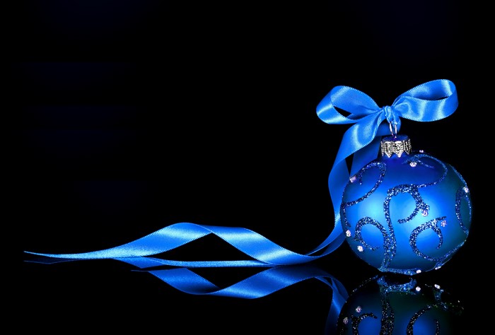 Blue Christmas Ornament with Ribbon and Bow on Black Background