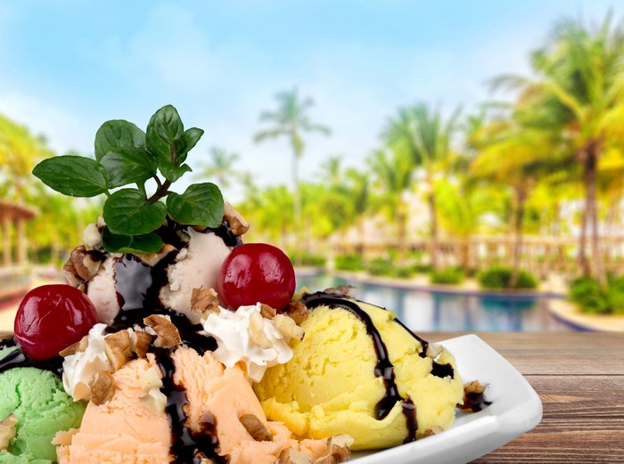 Ice cream sundae with cherries and nuts