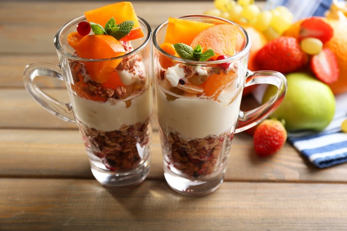 Muesli and fruit parfait in mugs
