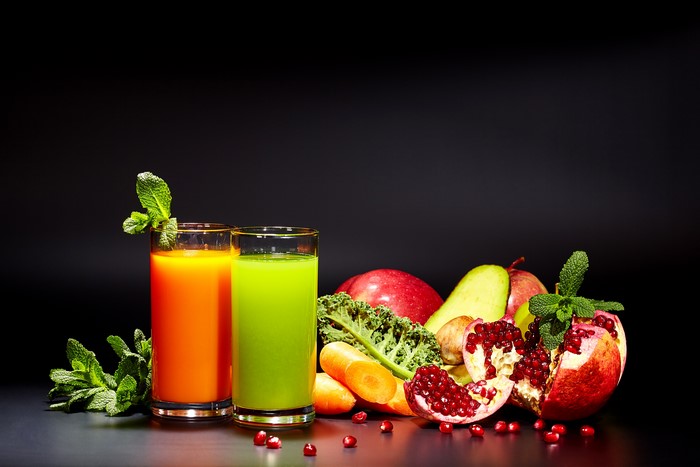 Two glasses of juice with fruits and vegetables