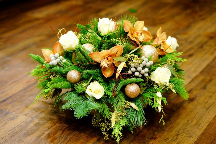 Christmas floral arrangement with roses and orchids