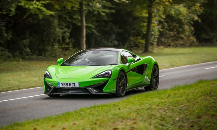 McLaren 570S Coupe driving on a road