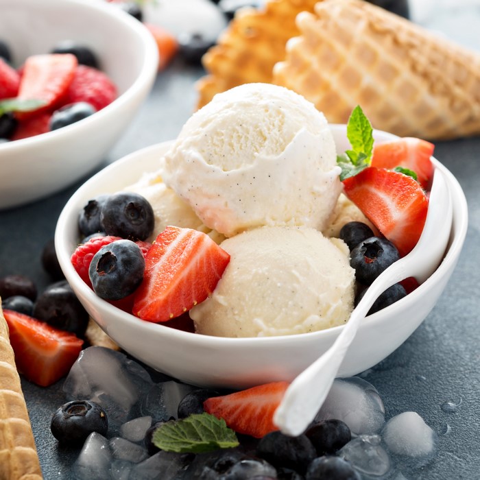 Vanilla ice cream with berries and waffle cones
