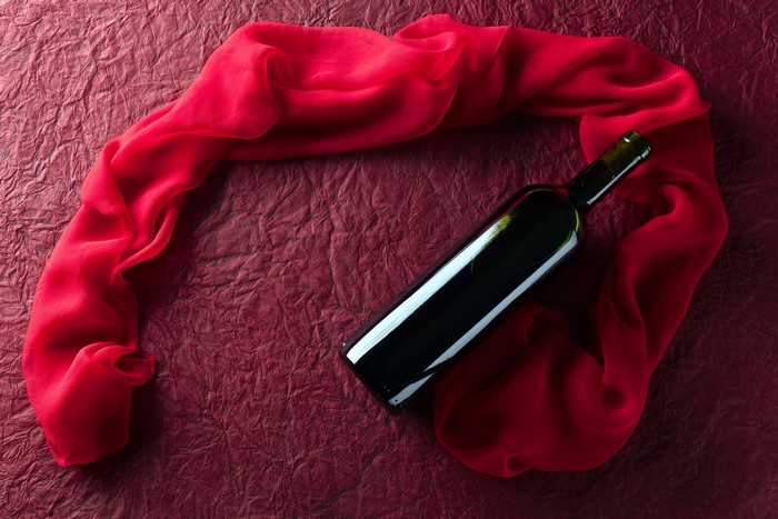 Wine bottle with red scarf