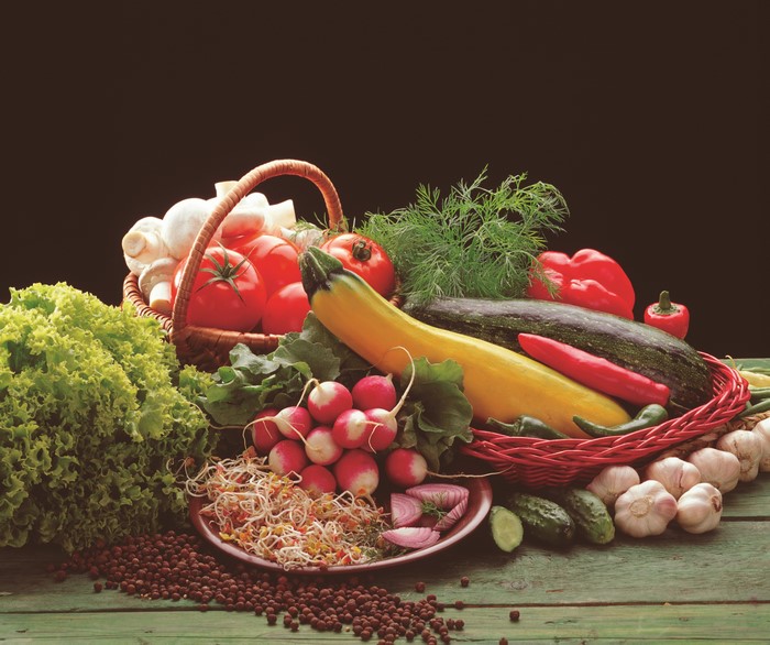 Vegetables including tomatoes, radishes, garlic, and peppers