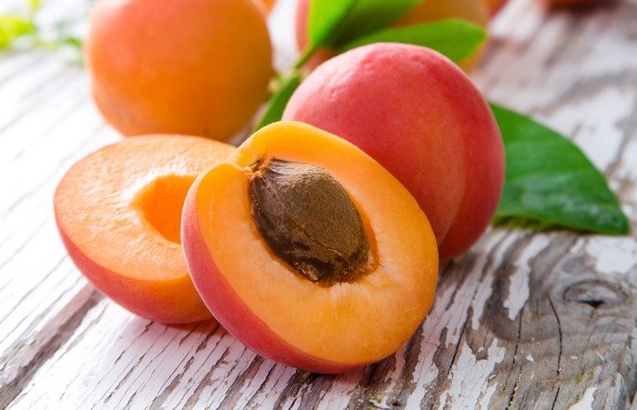 Apricots on a wooden surface