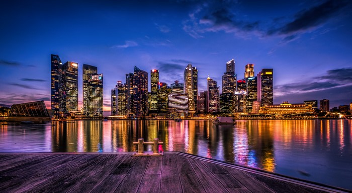 Singapore skyline at night with reflections