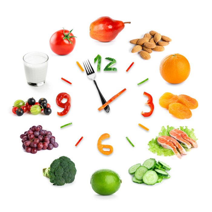 Food clock with fruits, vegetables, and fish