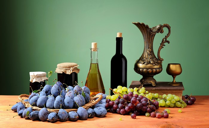 Still-life with wine, grapes, plums, and a jug