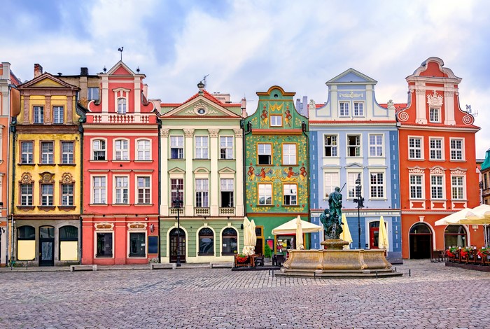 Colorful historic buildings and fountain in Poznan, Poland