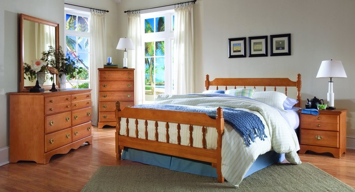 Bedroom with wooden furniture and tropical view