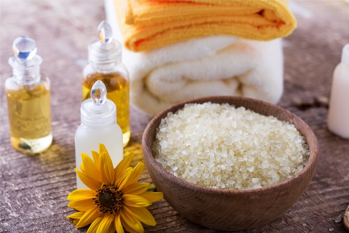 Spa products with towels and flower