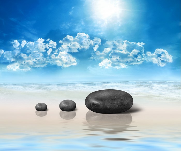 Stones on a beach with ocean and sky