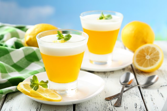 Two lemon desserts with mint and lemon slices