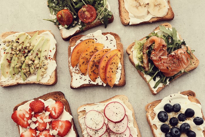 Assortment of open-faced sandwiches with various toppings