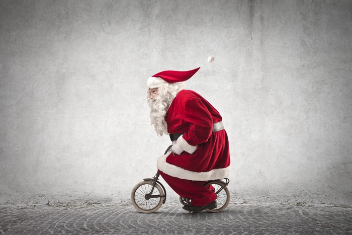 Santa Claus riding a bicycle