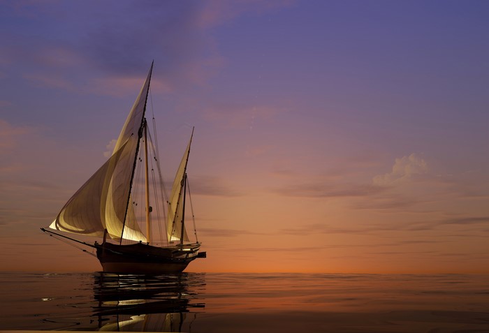 Sailboat on the sea at sunset