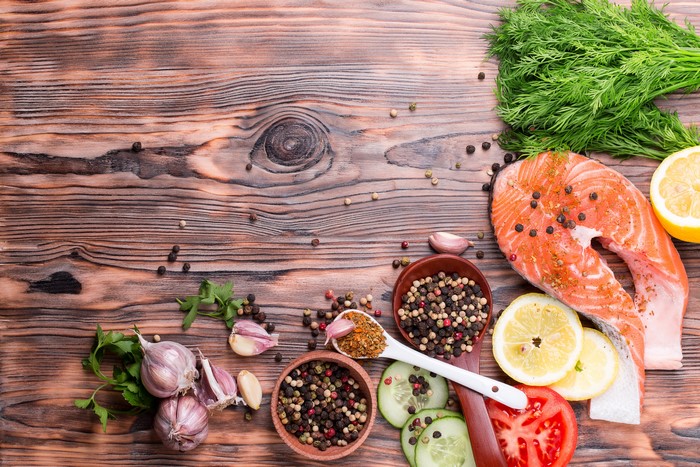 Salmon steak with spices, garlic, lemon, and dill