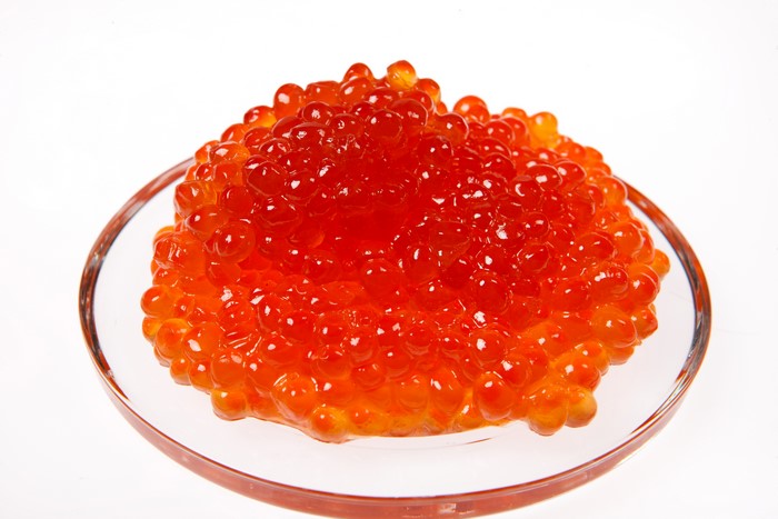 Red caviar in a glass dish
