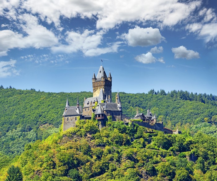 Reichsburg Cochem castle on a green hill in Germany
