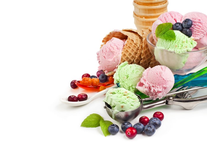 Ice cream scoops with berries and cones