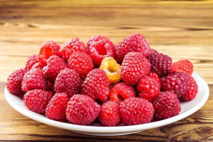 Raspberries on a white plate
