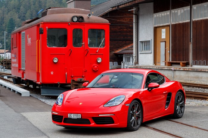 Red Porsche 718 Cayman S and Train