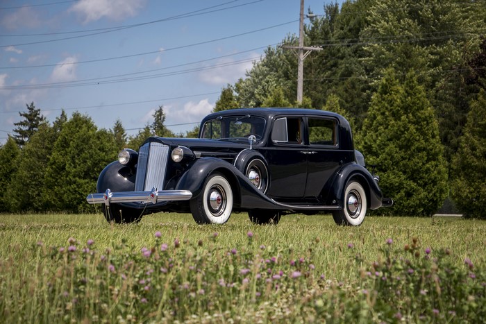 1937 Packard Twelve Club Sedan in a field