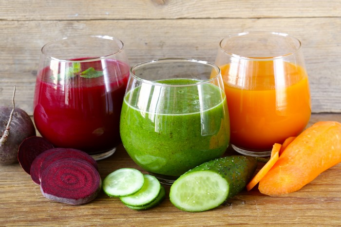 Three glasses of juice with vegetables