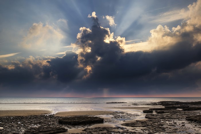 Dunraven Bay, Wales: Dramatic Clouds and Rocky Shoreline