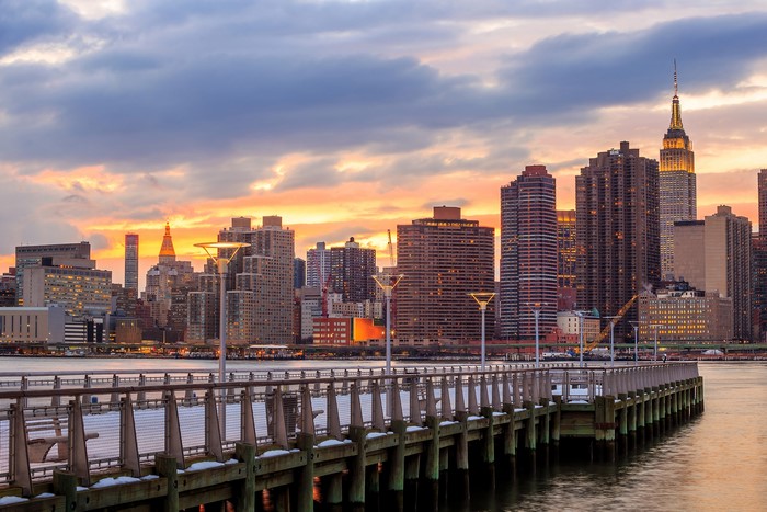 New York City skyline at sunset with pier