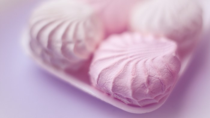 Pink and white zefir marshmallows in a tray