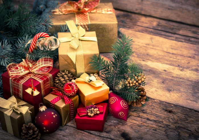 Christmas gifts and decorations on wood planks