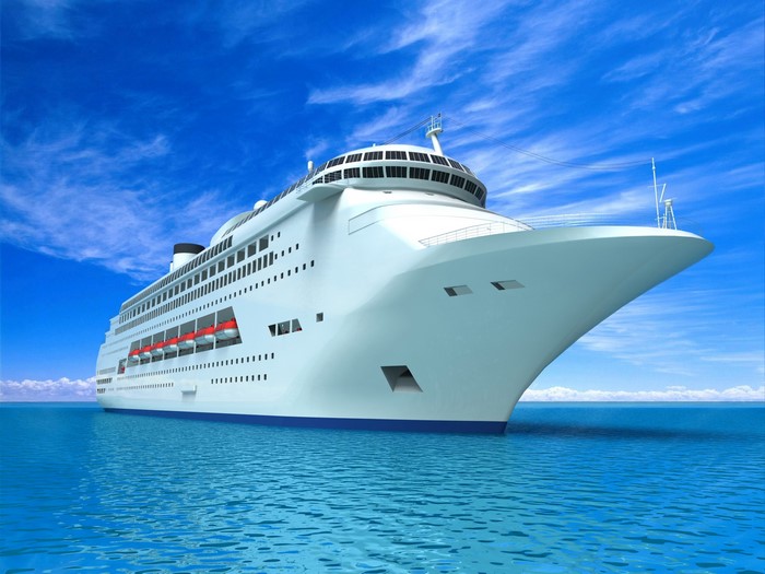 Cruise liner sailing on the ocean under a blue sky