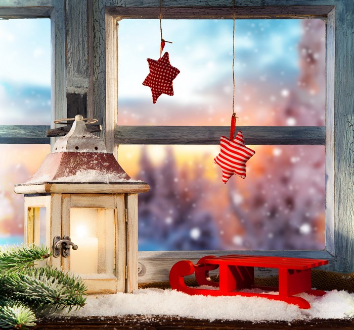 Christmas window with lantern and sled