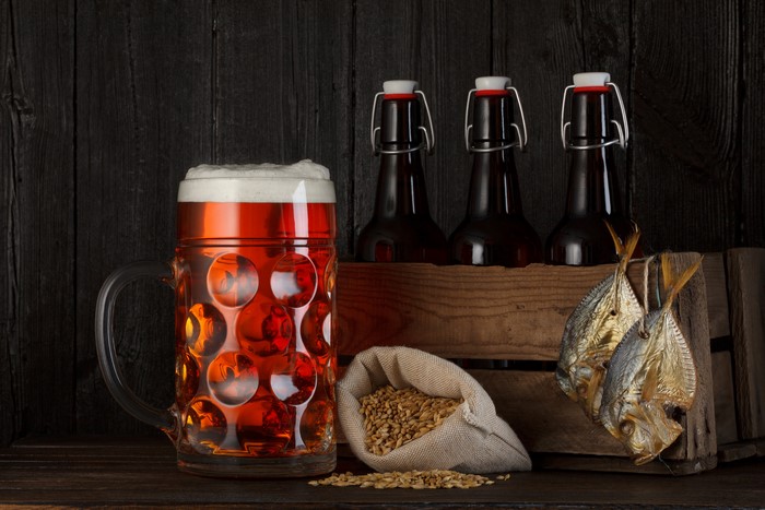 Beer mug, bottles, grain, and dried fish